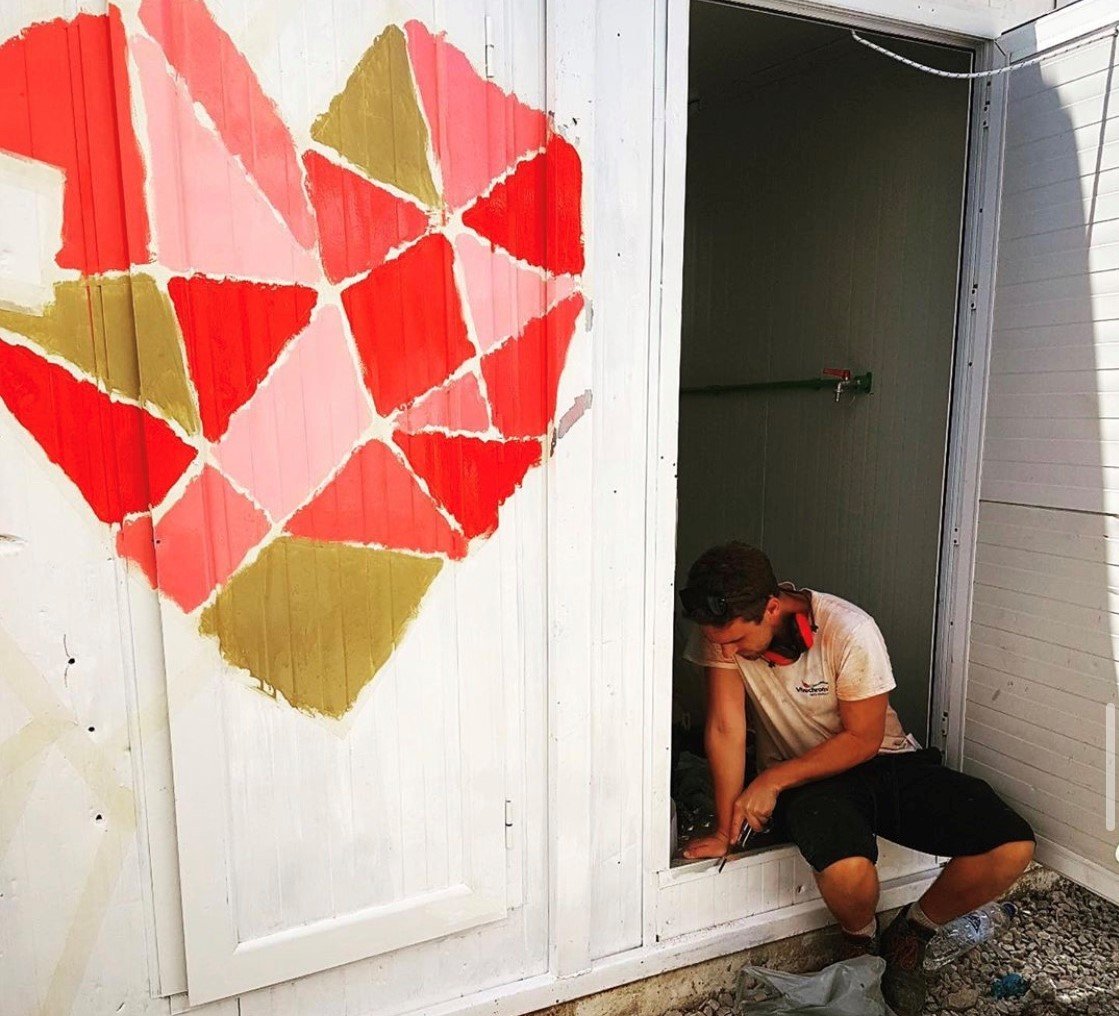 Volunteer fixes toilet block